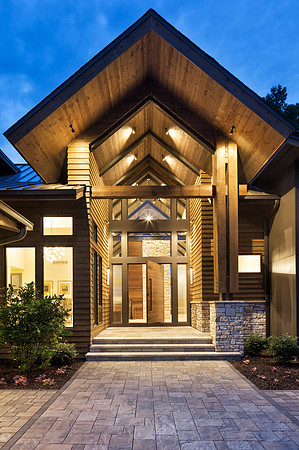 Magnificent twilight entry featuring a center swing door