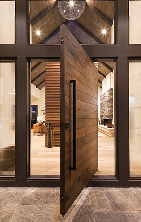 Magnificent twilight entry featuring a center swing door