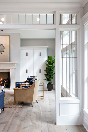 Stunning leaded glass divides this great room and dining room